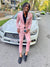 Guy wearing pink prom suit