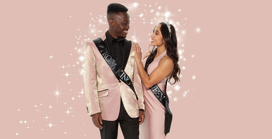 Young man in pink prom tuxedo jacket with prom date at prom