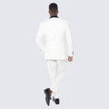 man wearing three piece white tuxedo jacket at a wedding 