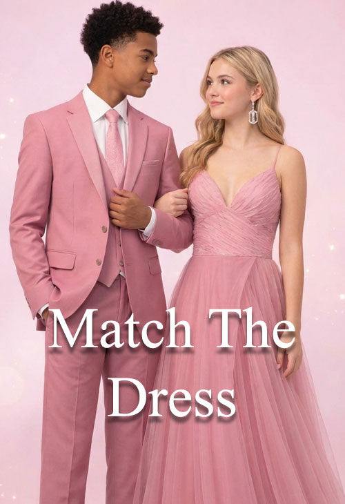 prom couple with guy wearing a pink prom suit, girl wearing a pink prom dress