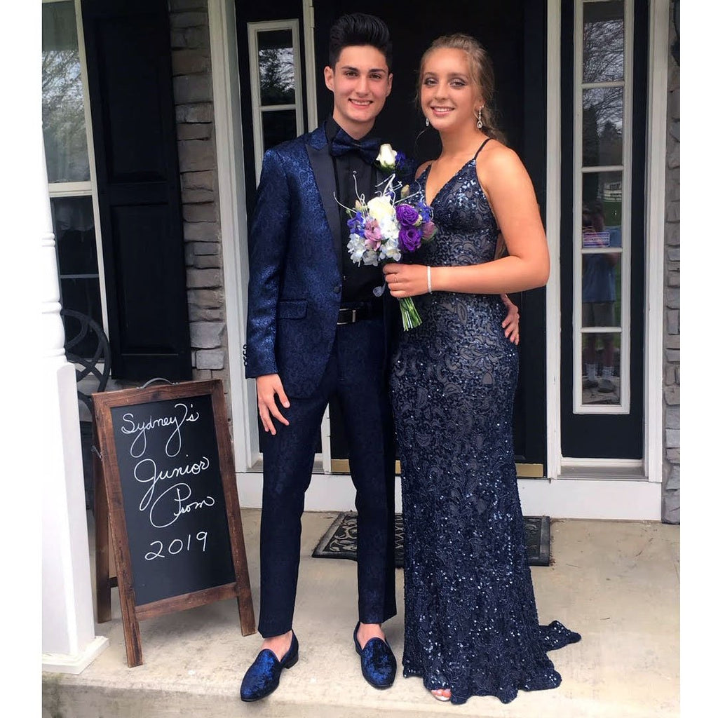prom couple with guy wearing a blue prom suit jacket