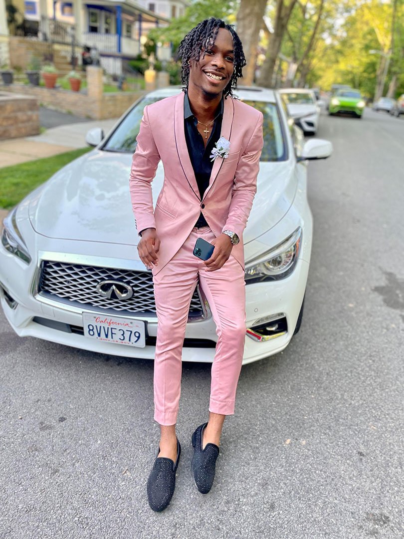 Guy wearing pink prom suit
