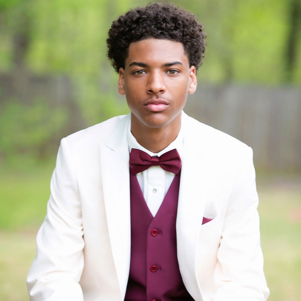 guy wearing ivory prom tuxedo
