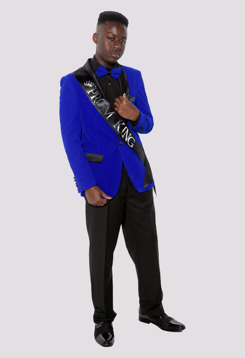 prom king wearing a blue velvet prom tuxedo jacket