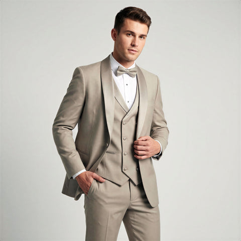 Man wearing a champagne shawl tuxedo with a white shirt and bow tie on a light gray background